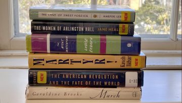 Photo of stack of books on a window sill